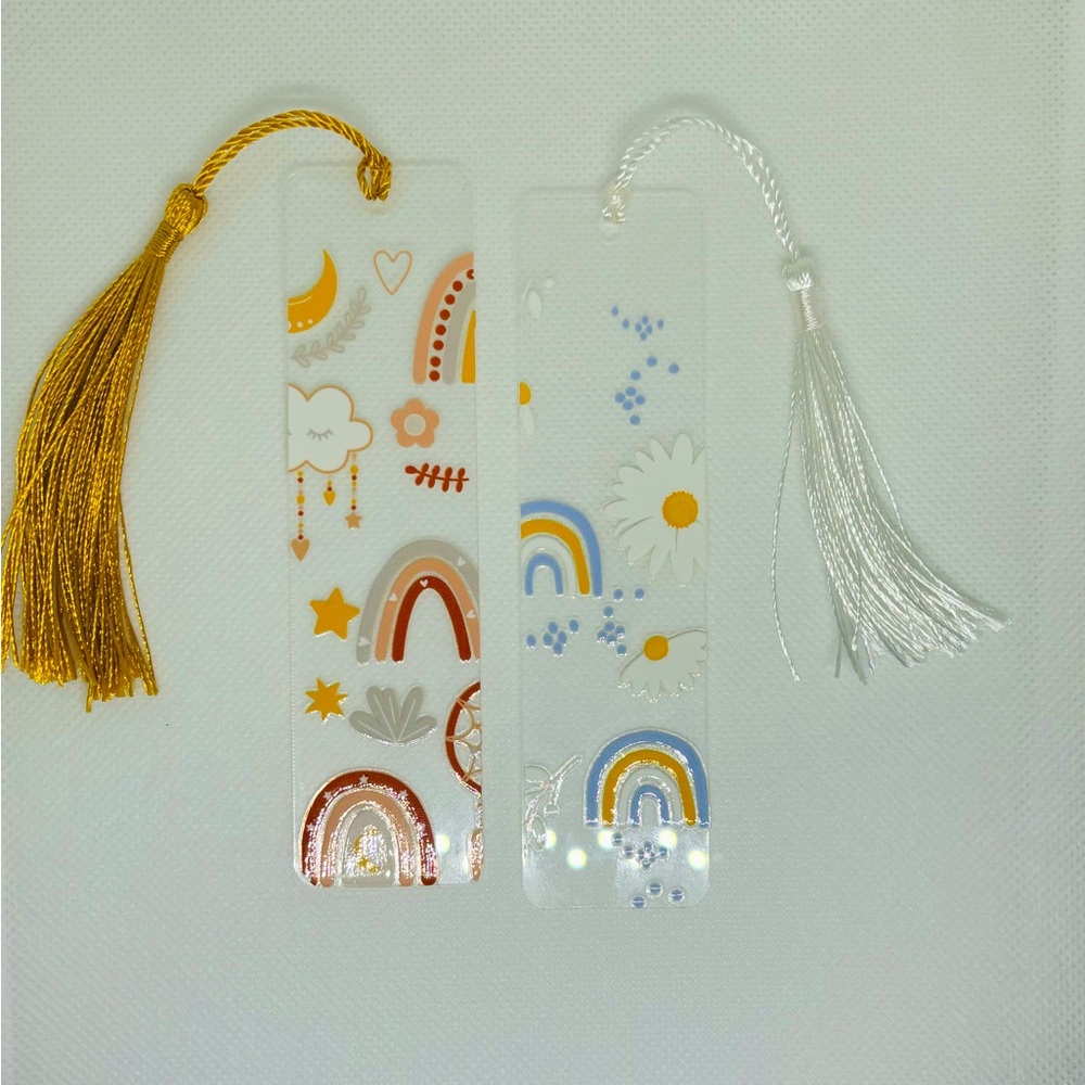 2 mini acrylic bookmarks.